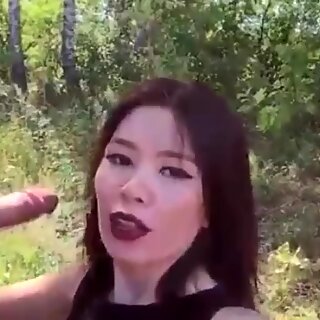Asian girl loves from behind in the forest